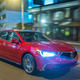 An Acura RLX driving at night.